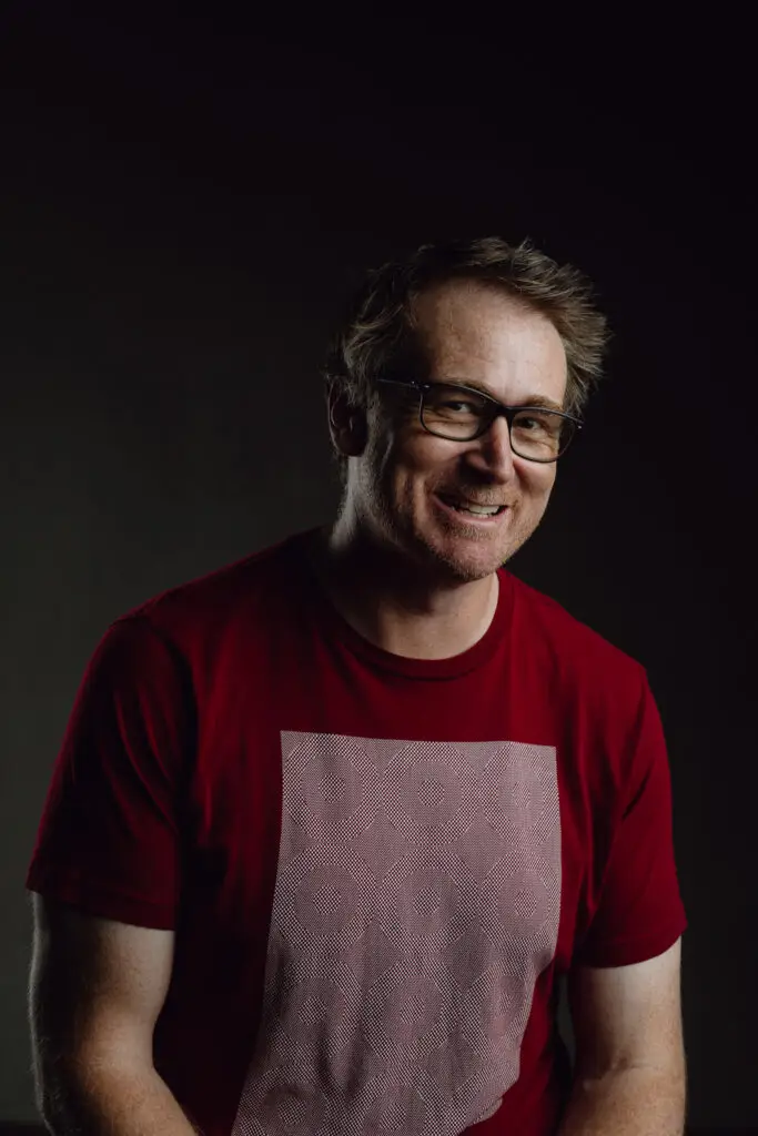 Seated photo of QKP employee Nathan Gallagher